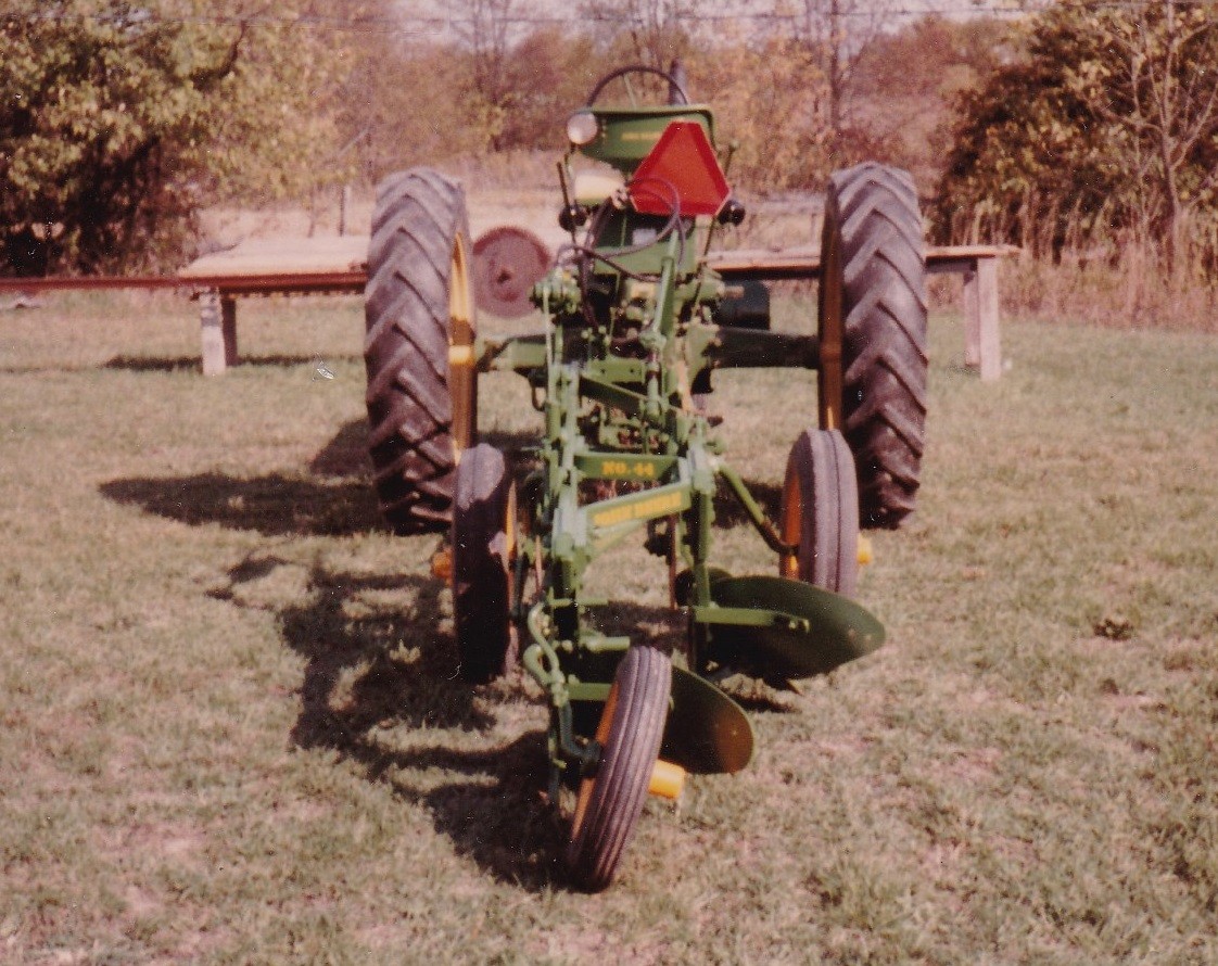 John Deere 50 with mounted plow.